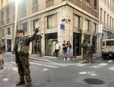 Soldiers of French anti terrorist plan "Vigipirate Mission", secure the area, near the site of a suspected bomb attack in central Lyon, Friday May, 24, 2019. A small explosion Friday on a busy street in the French city of Lyon lightly injured several people, local officials said.  (AP Photo/Sebastien Erome)