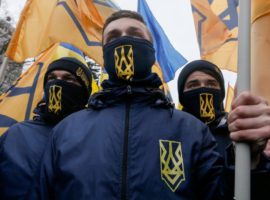 epa05808381 Members of different nationalists parties attend the so-called 'March of National Pride' in downtown Kiev, Ukraine, 22 February 2017. Ukrainian right-wing political parties, including 'Svoboda', the 'Right Sector' and members of the volunteer Corps 'Azov', announced about joining their efforts to put pressure on the Ukrainian power holders for the implementation of reforms in Ukraine. They also demand to stop the trade of some Ukrainian businessmen with Russian-backed separatists in the eastern Ukraine.  EPA/SERGEY DOLZHENKO