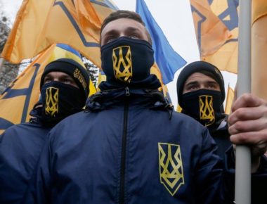 epa05808381 Members of different nationalists parties attend the so-called 'March of National Pride' in downtown Kiev, Ukraine, 22 February 2017. Ukrainian right-wing political parties, including 'Svoboda', the 'Right Sector' and members of the volunteer Corps 'Azov', announced about joining their efforts to put pressure on the Ukrainian power holders for the implementation of reforms in Ukraine. They also demand to stop the trade of some Ukrainian businessmen with Russian-backed separatists in the eastern Ukraine.  EPA/SERGEY DOLZHENKO