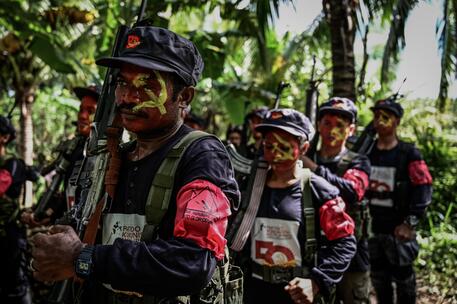 epa07250097 Fighters of the New People's Army-Melito Glor Command (NPA-MGC) gather at an undisclosed location in the mountains of Sierra Madre in Quezon Province, south of Manila, Philippines, 26 December 2018, to celebrate the 50th year founding of the Communist Party of the Philippines (issued 27 December 2018). New People's Army rebels celebrate the founding anniversary of the Communist Party of the Philippines (CPP) in small groups to avoid military operations according to a media release by the CPP information bureau. The CPP was established along Maoist lines on 26 December 1968, by then university professor Jose Maria Sison and a handful of followers who broke away from the old Soviet-oriented party.  EPA/ALECS ONGCAL  ATTENTION: This Image is part of a PHOTO SET