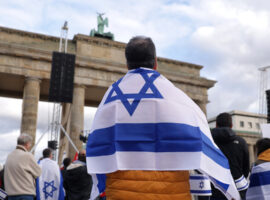 BERLIN, GERMANY - OCTOBER 22: People, including some draped in Israeli flags, attend a demonstration to show solidarity with Israel and against anti-semitism on October 22, 2023 in Berlin, Germany. Thousands of people attended the event in front of the Brandenburg Gate as the conflict between Hamas and Israel continues to range following the deadly October 7 incursions by Hamas fighters from Gaza into Israel.  (Photo by Sean Gallup/Getty Images)